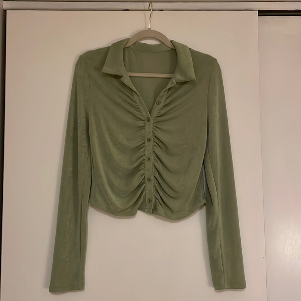Green button down. Stretchy material. Somewhat cropped.